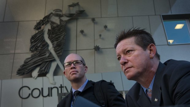 Franc Titan (right) and detective senior Constable Craig Jarvis, who helped Mr Titan bring David Whitcroft to justice