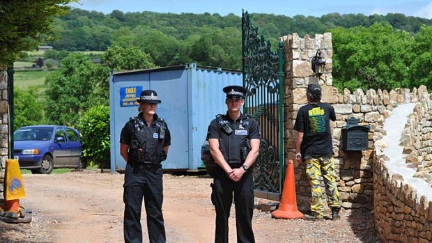 Police stand guard outside Joss Stone's home.
