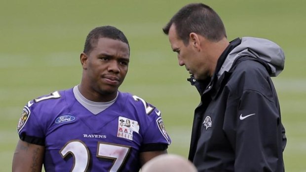 Two-game suspension ... Baltimore Ravens running back Ray Rice speaks to offensive coach Gary Kubiak at training camp.