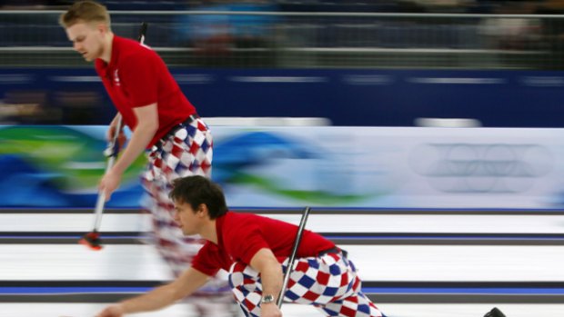 Trousers down ... Norway's Thomas Ulsrud delivers the stone.