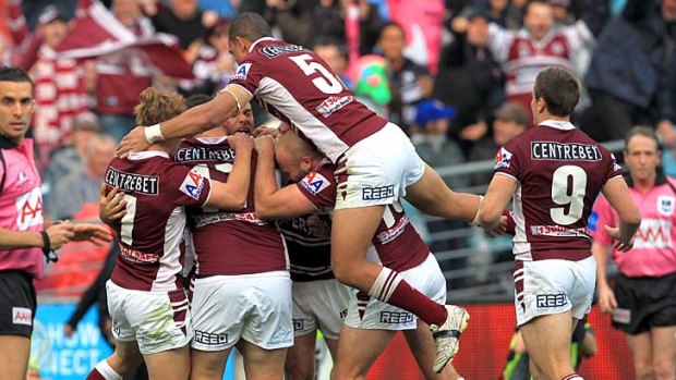 Manly celebrate after Brett Stewart goes over for the first try in the 2011 NRL Grand Final.
