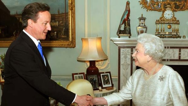 New Prime Minister ... David Cameron is greeted by the Queen.