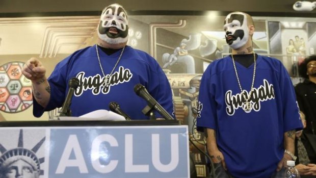 Joseph Bruce aka Violent J, left, and Joseph Utsler aka Shaggy 2 Dope, member of the Insane Clown Posse address the media in Detroit.