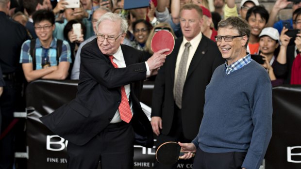 Warren Buffett plays table tennis with Microsoft founder Bill Gates on the sidelines of the Berkshire Hathaway shareholders meeting in Omaha, Nebraska.