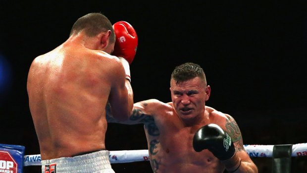 On attack: Danny Green  fights Roberto Bolonti  in Melbourne in August. 