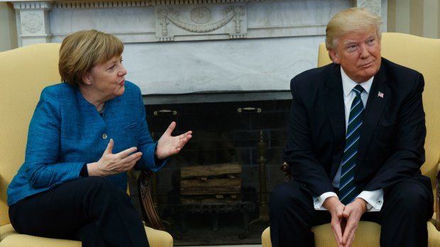 President Donald Trump meets with German Chancellor Angela Merkel in the Oval Office.