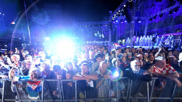 Tens of thousands of Croatians cheered the country's entry into the European Union at midnight on Sunday, almost two decades after the former Yugoslav republic's bloody independence war ended.
