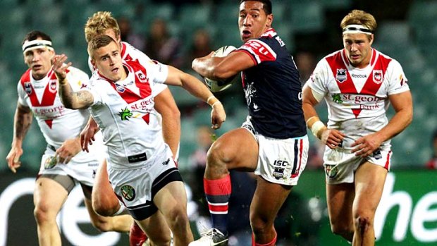 Injury blow ... Tautau Moga of the Roosters.