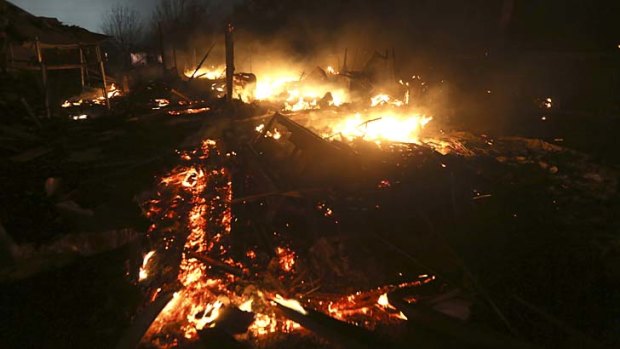 The day after: the remains of a home burn early on Thursday morning.