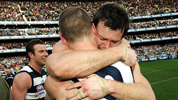 Cameron Mooney in premiership embrace with James Kelly last year.