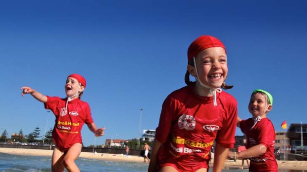 Sun, sand and fun ... Tabitha Palmer, 6, centre, plays with Liv Knight, 7, and Harry Hamilford, 5, at North Bondi. The girls are in the under-7 nippers.