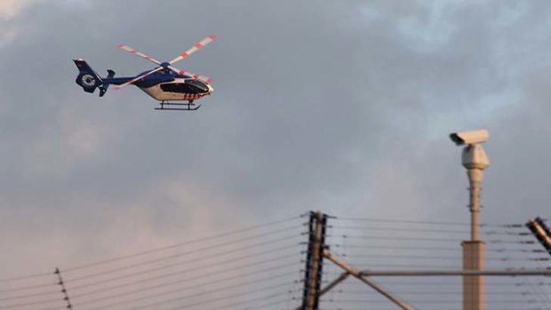 A helicopter believed to be carrying former general Ratko Mladic flies over Scheveningen prison in The Hague.
