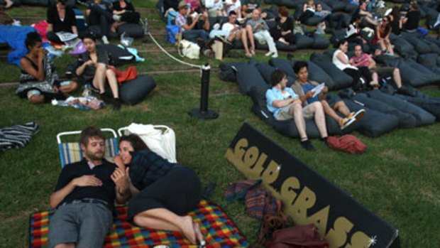 A glass of wine, canapes and a good lie down ...  Sydneysiders enjoy being pampered  at the Moonlight Cinema in Centennial Park.