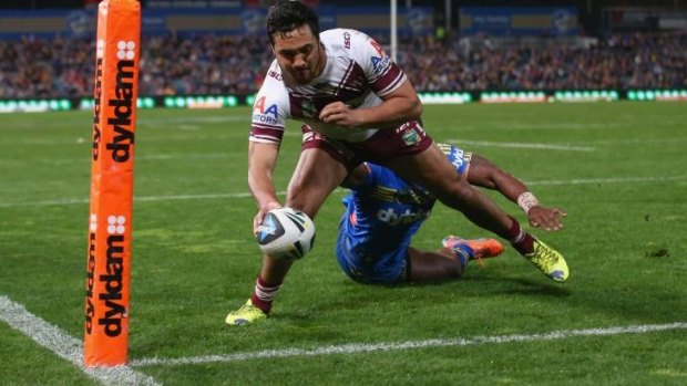 Peta Hiku goes over in the corner for Manly.
