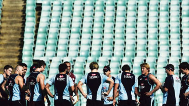 Standing room only ... the Waratahs players take a breather during training at Sydney Football Stadium yesterday.