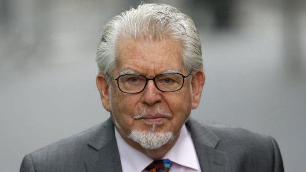 Entertainer Rolf Harris arrives at Southwark Crown Court in London on May 9, 2014.