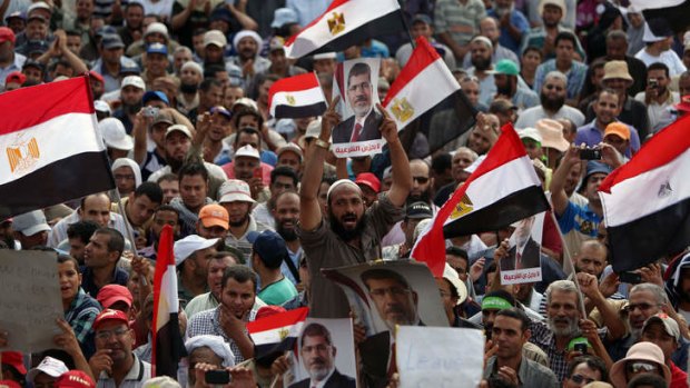 Supporters of deposed president Mohammed Mursi rally outside Cairo's Rabaa al-Adawiya mosque.