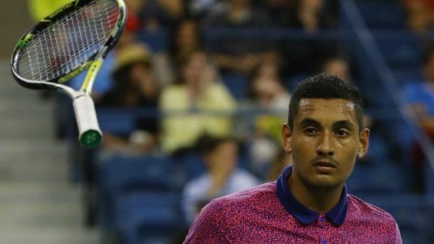 Nick Kyrgios throws his racquet after losing a point to Tommy Robredo.