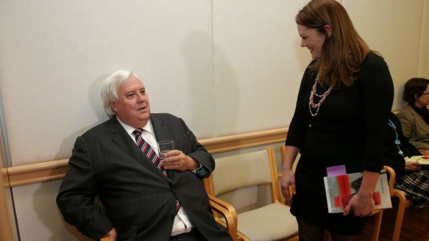 Palmer United Party leader Clive Palmer speaks with Greens Senator Sarah Hanson-Young. Mr Palmer's senators are set to approve the Abbott Government's bills to repeal to carbon tax.