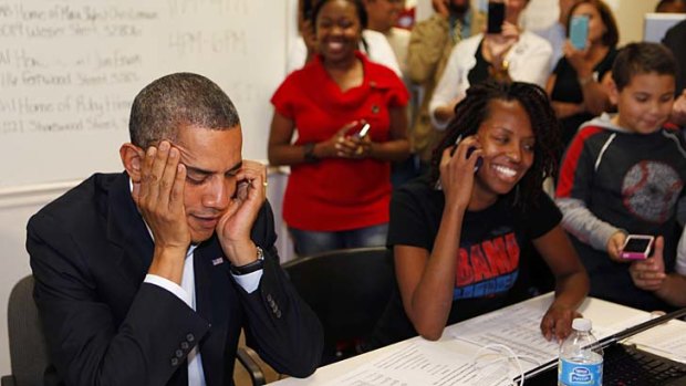 Helping out ... Barack Obama with volunteers in his campaign field office in Orlando.