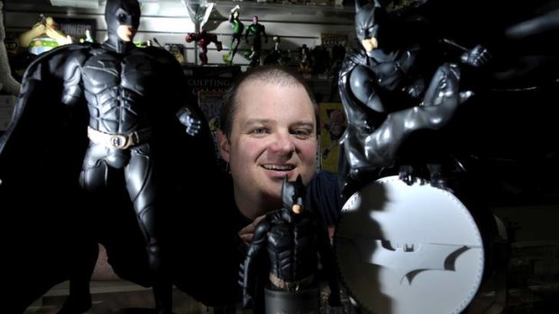 Impact Comics owner Mal Briggs with some of the latest Batman Comics and figurines.