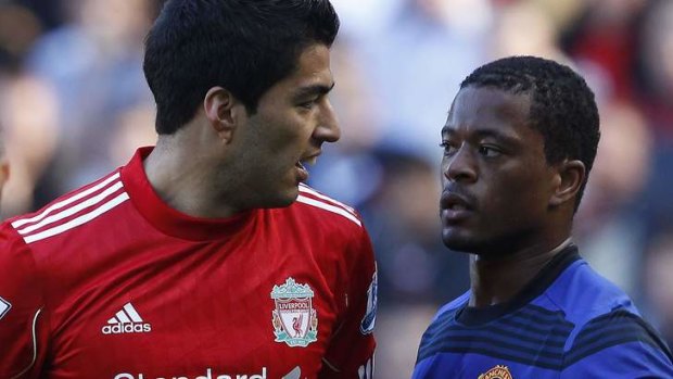 Bitter feud: Liverpool's  Luis Suarez refused to shake Manchester United defender Patrice Evra's hand after a long-standing racism row.