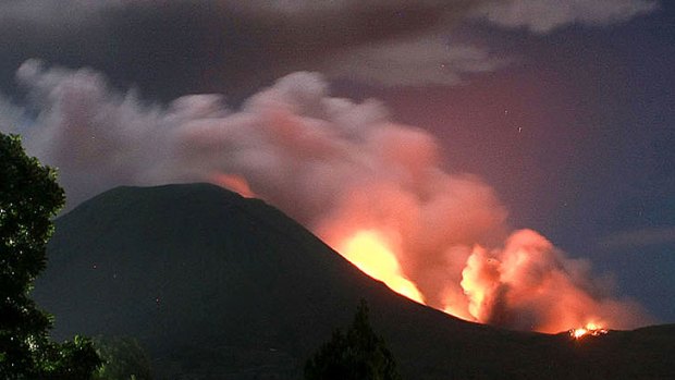 The Indonesian volcano erupted late July 14, spewing rocks, lava and ash hundreds of metres into the air.