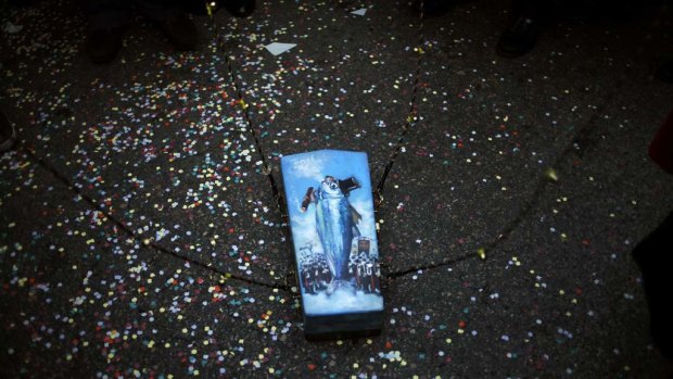 A small coffin containing a mock sardine at "The Burial of the Sardine"  procession which marks the end of Madrid's carnival this week.