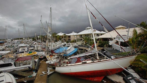 Boats lay strewn around Port Hinchinbrook in the wake of Cyclone Yasi.