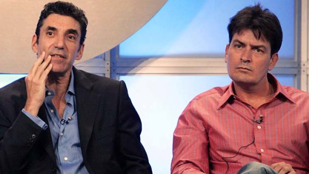 $100m lawsuit ... Charlie Sheen, right, pictured with Chuck Lorre, is suing Warner Brothers.