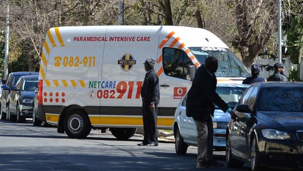 Homecoming: An ambulance carrying Nelson Mandela arrives at his house in Johannesburg on Sunday.