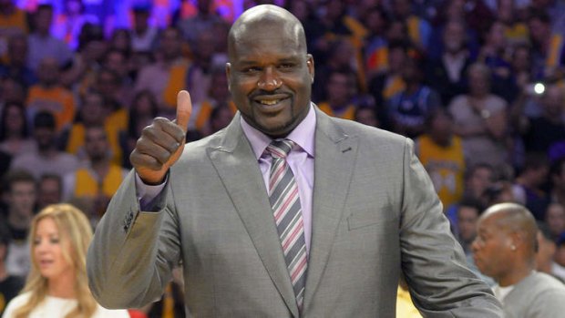Honoured: Former Los Angeles Lakers center Shaquille O'Neal gestures during ceremonies to retire his jersey during halftime of an NBA game between the Lakers and Dallas Mavericks in April.