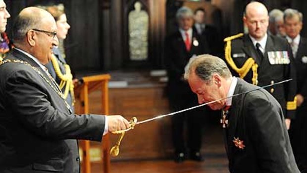 Ralph Norris, at the pointy end, as Kiwi Governor General Sir Anand Satyanand bestows a knighthood on the CommBank boss.