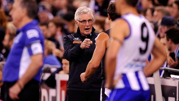 This is how you do it... Carlton coach Mick Malthouse has a word to Andrew Carrazzo.