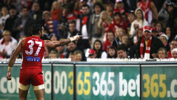 Adam Goodes points the finger after being called an 'ape' by a young Collingwood supporter during the AFL's Indigenous Round.