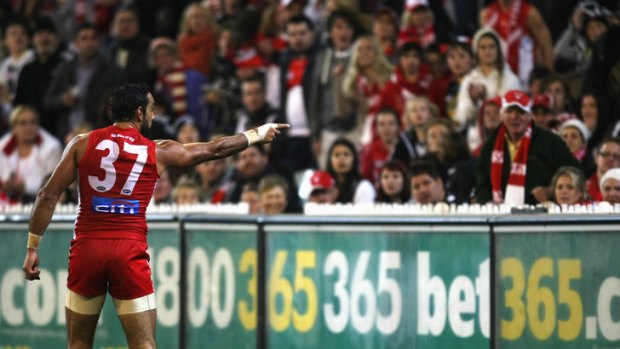 Iconic moment: Adam Goodes points the finger after being called an 'ape' by a young Collingwood supporter during the AFL's Indigenous Round.