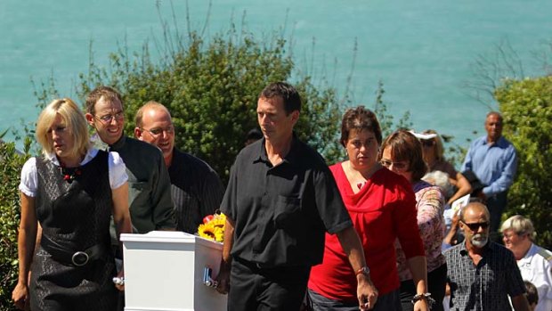 "A spirited private person" ... friends and family carry the coffin of Shane Tomlin at his funeral in Kaikoura.