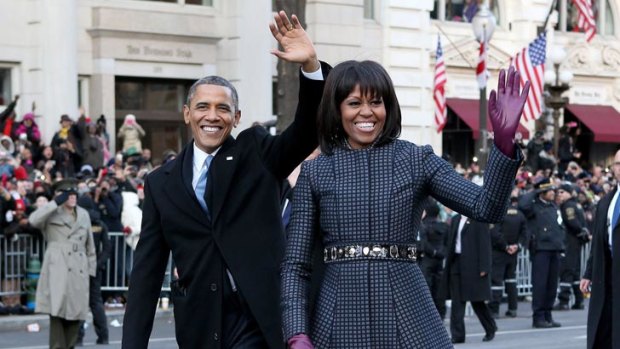 Earlier in the day, Michelle wore a Thom Browne coatdress, teamed with a J Crew belt, to the inauguration parade.