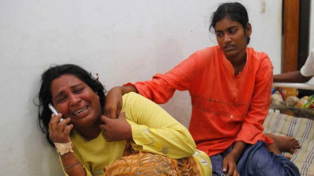 A woman, who is a suspected asylum seeker, cries after finding out about the death of her husband.