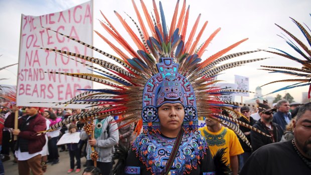 A supporter of the Bears Ears and Grand Staircase-Escalante National Monuments wears a colourful headdress during a rally in Salt Lake City. 