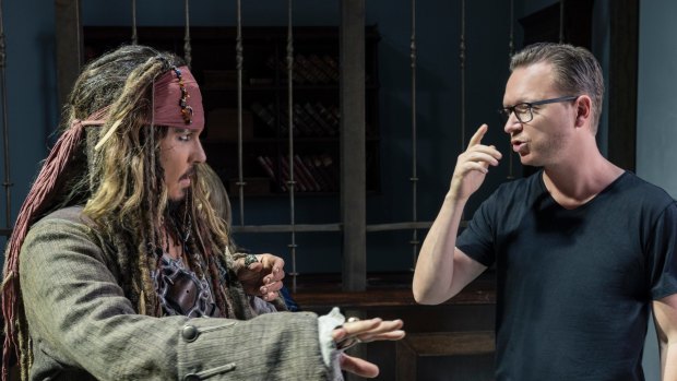 Johnny Depp as Captain Jack Sparrow with director Espen Sandberg on the set of Pirates of the Caribbean: Dead Men Tell No Tales.