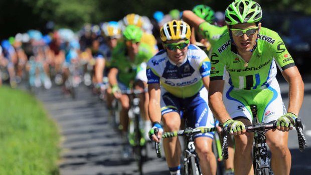 Protecting the yellow jersey: Team Cannondale and Orica-GreenEDGE lead the peloton chase of the breakaway.