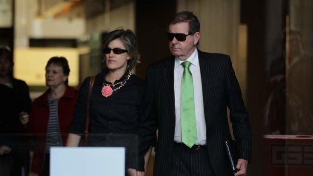 Peter Slipper accompanied by his wife.