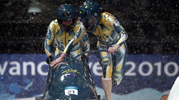Cool runnings ... Astrid Loch-Wilkinson, right, and Cecilia McIntosh start their run during a women's bobsleigh heat at the Vancouver 2010 Winter Olympics.