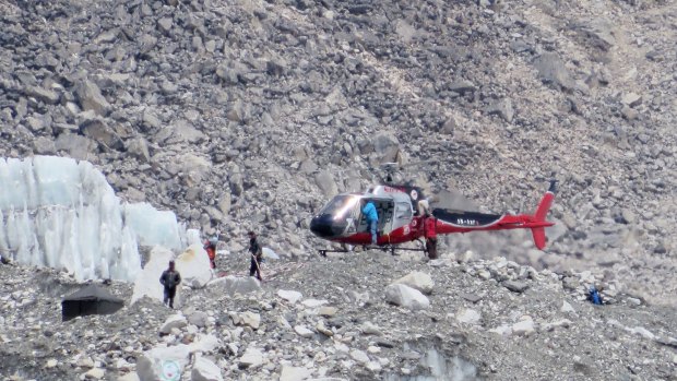 Nepalese rescue helicopter lands at Everest Base Camp during rescue efforts following an avalanche that killed 19 Nepalese sherpas in 2014.