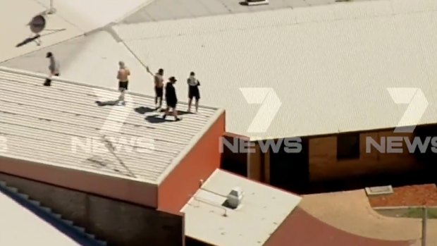 Youths on the roof of Malmsbury Youth Justice centre.