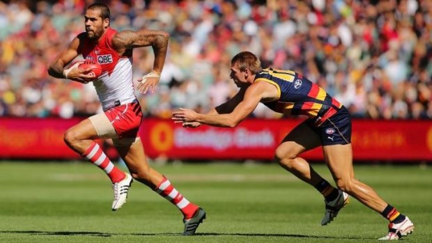 Off and running: Lance Franklin skips clear of Adelaide's Daniel Talia on Saturday. 