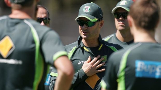Australia's captain Michael Clarke speaks with his players during a practice session on Sunday.