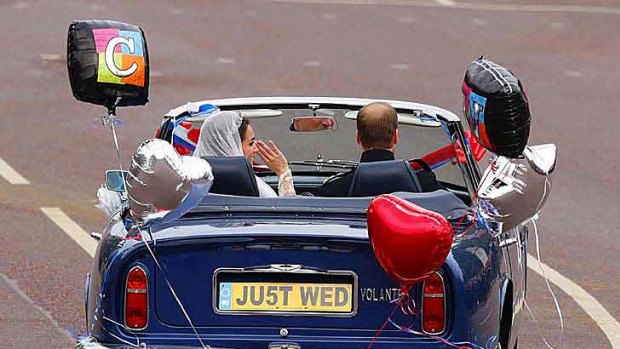 The royal couple leave Buckingham Palace for Clarence House.