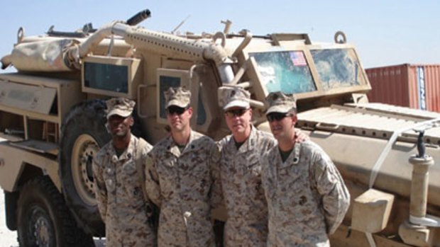 Casualty ... General James Amos and Sergeant James Ownbey (second from right and right) after the blast in Iraq in 2007. <i>Photo: Washington Post, courtesy US Marine Corps</i>